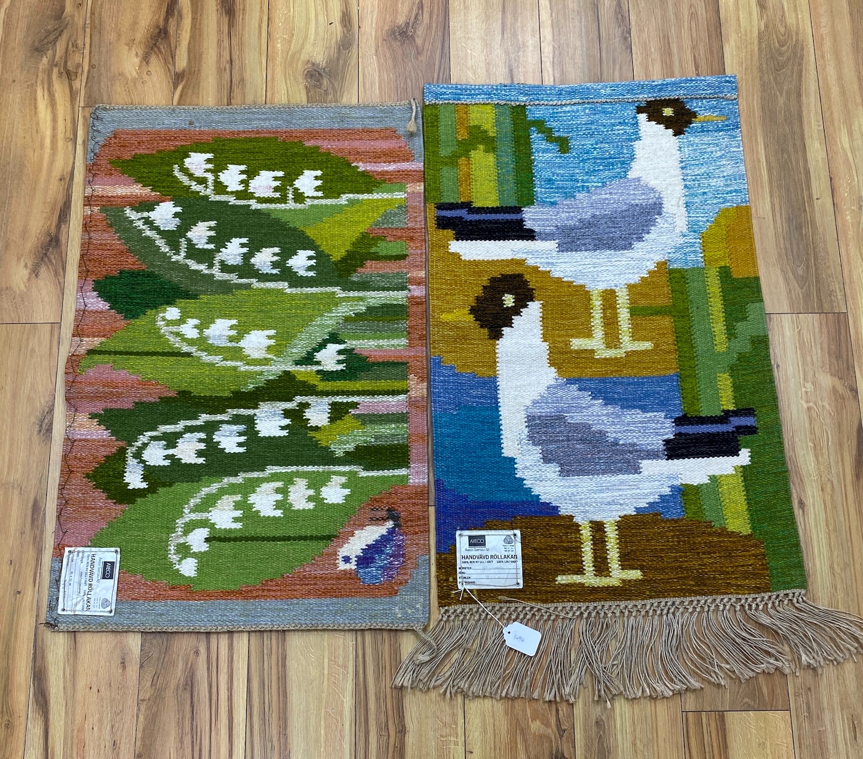 Two Axeco handvard tapestry rugs; Skrattner & Liljekonvalj, 55x88cm